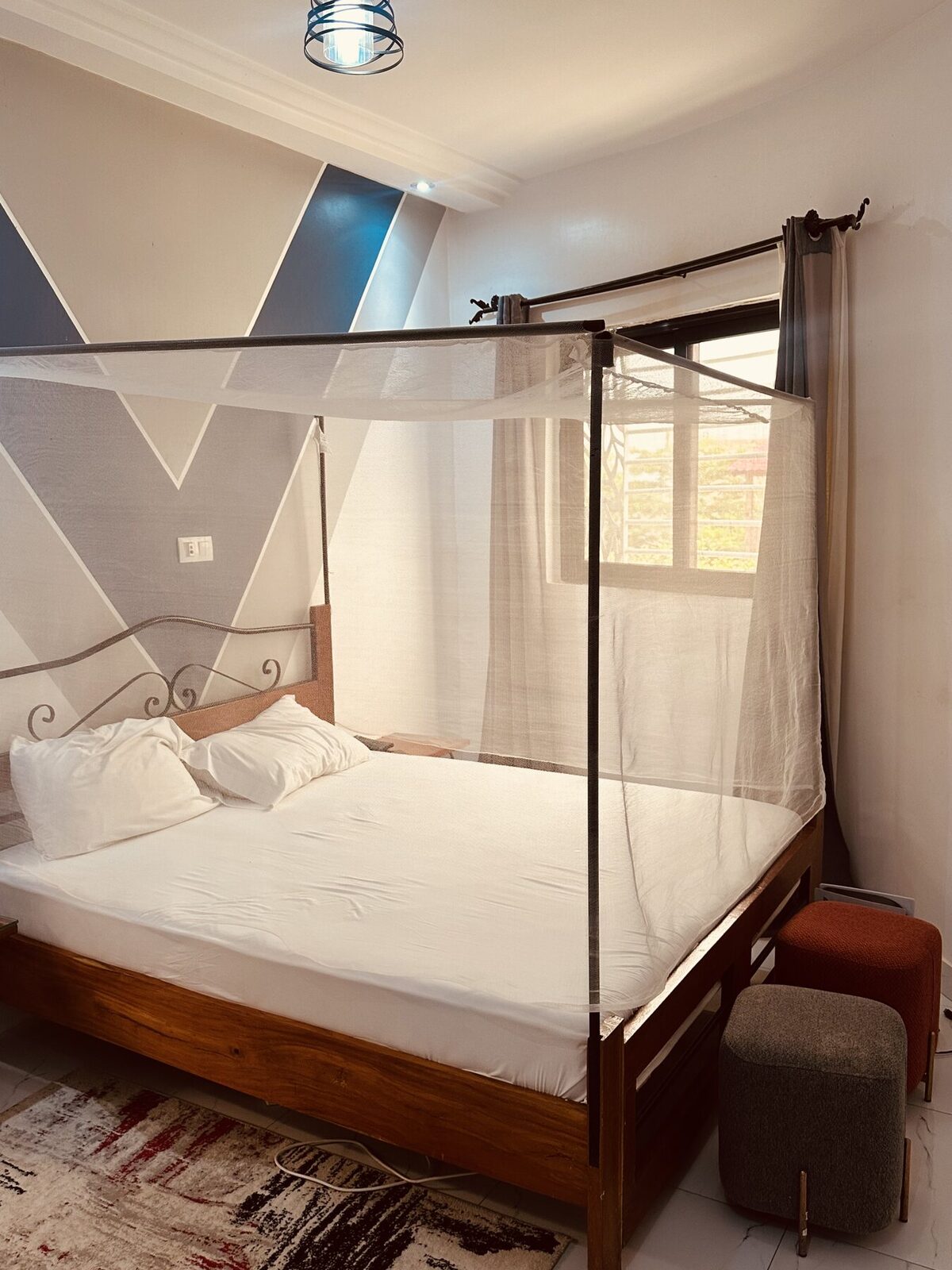 Suite avec lit à baldaquin et moustiquaire